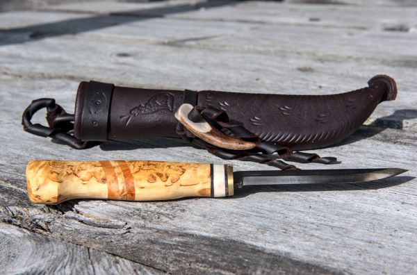 Knife with wooden handle and leather sheath
