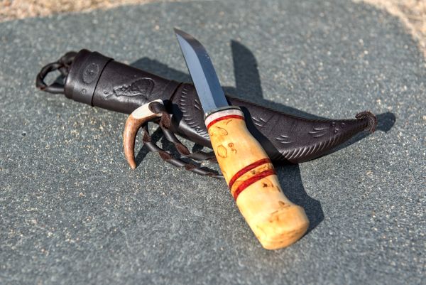 Knife with wooden handle and leather sheath