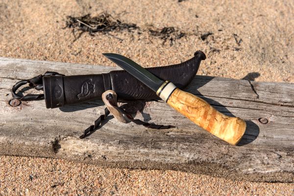Knife with wooden handle and leather sheath