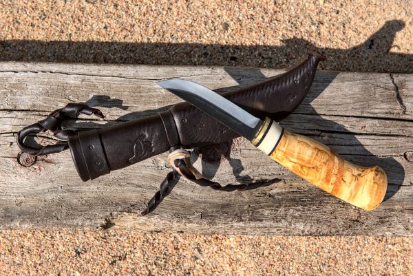 Knife with wooden handle and leather sheath