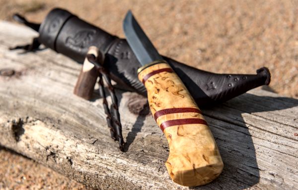 Knife with wooden handle and leather sheath