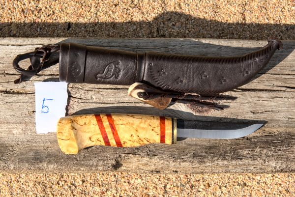 Knife with wooden handle and leather sheath