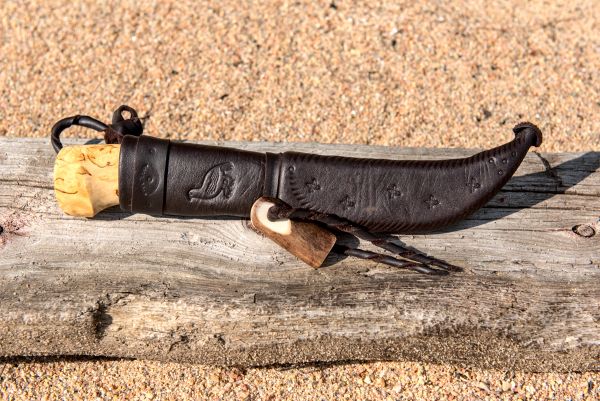 Knife with wooden handle and leather sheath