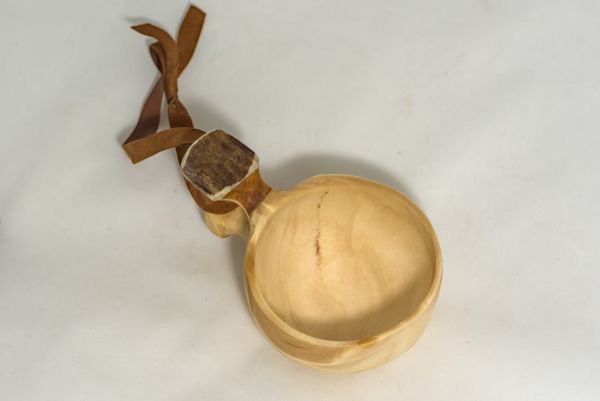 wooden cup with leather strap