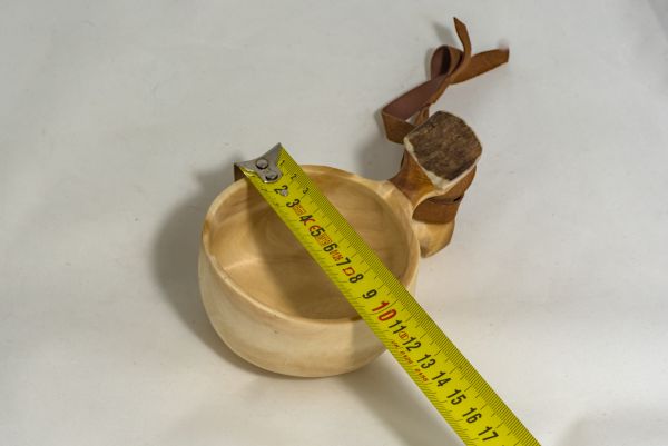 wooden cup with leather strap