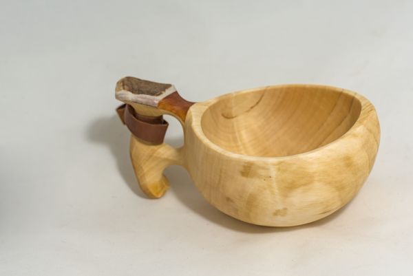 wooden cup with leather strap