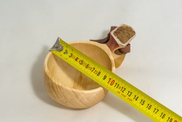 wooden cup with leather strap