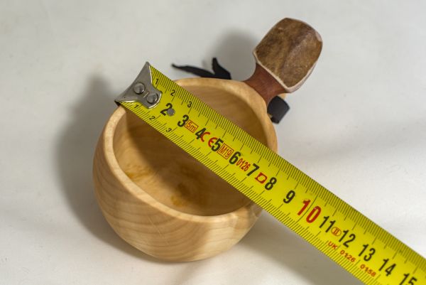 wooden cup with leather strap