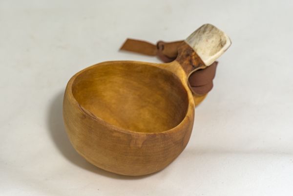 wooden cup with leather strap