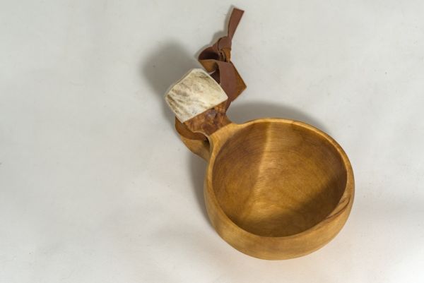 wooden cup with leather strap