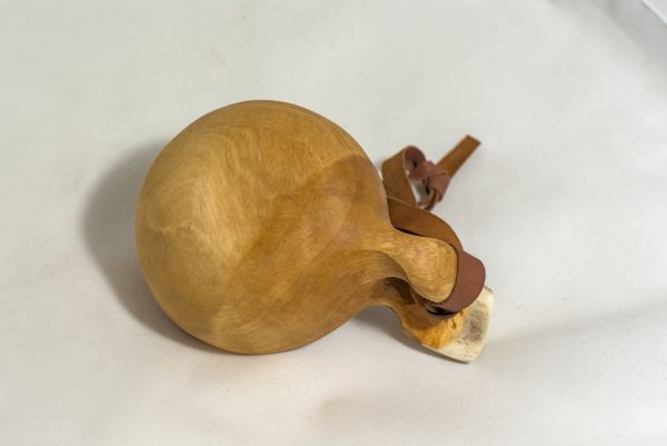 wooden cup with leather strap