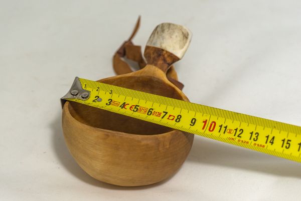 wooden cup with leather strap