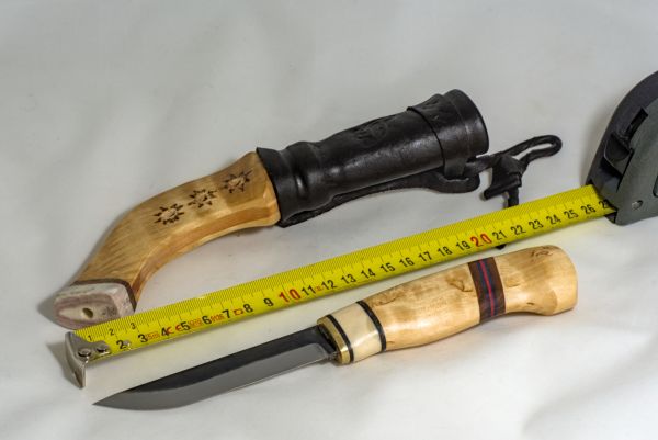 Knife with wooden handle and sheath made from wood and leather