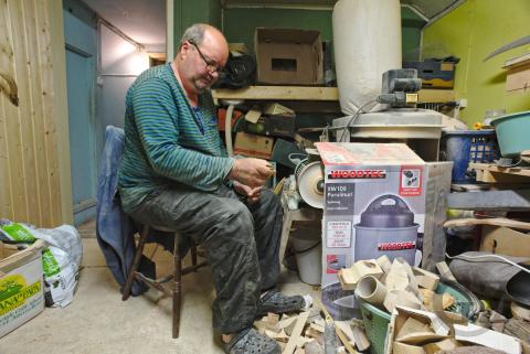 person working in wood workshop