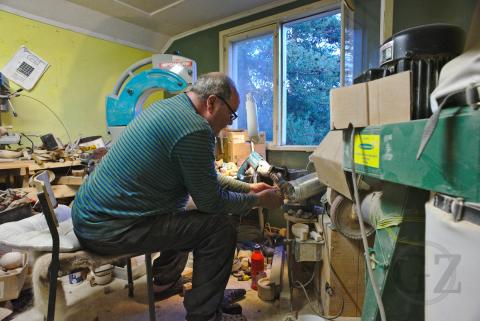 person working in wood workshop
