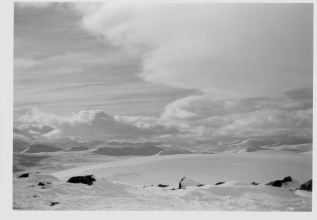 snow covered fell landscape with clouds
