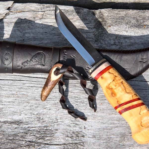 Knife with wooden handle and leather sheath