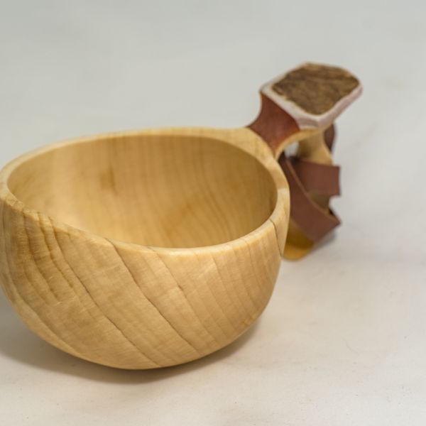 wooden cup with leather strap