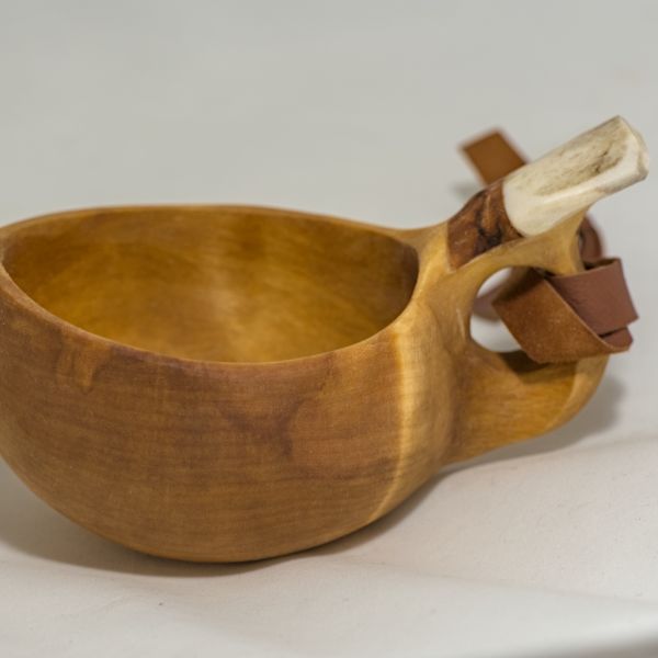 wooden cup with leather strap